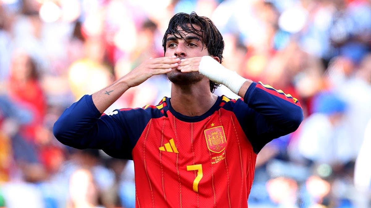 Ferran Torres celebrates after scoring for Spain during a match in East Rutherford, New Jersey.