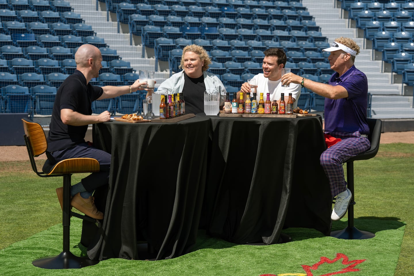 From left: Sean Evans, Fortune Feimster, Jimmy Tatro, and Will Ferrell in "Hot Ones: Extra Heat."