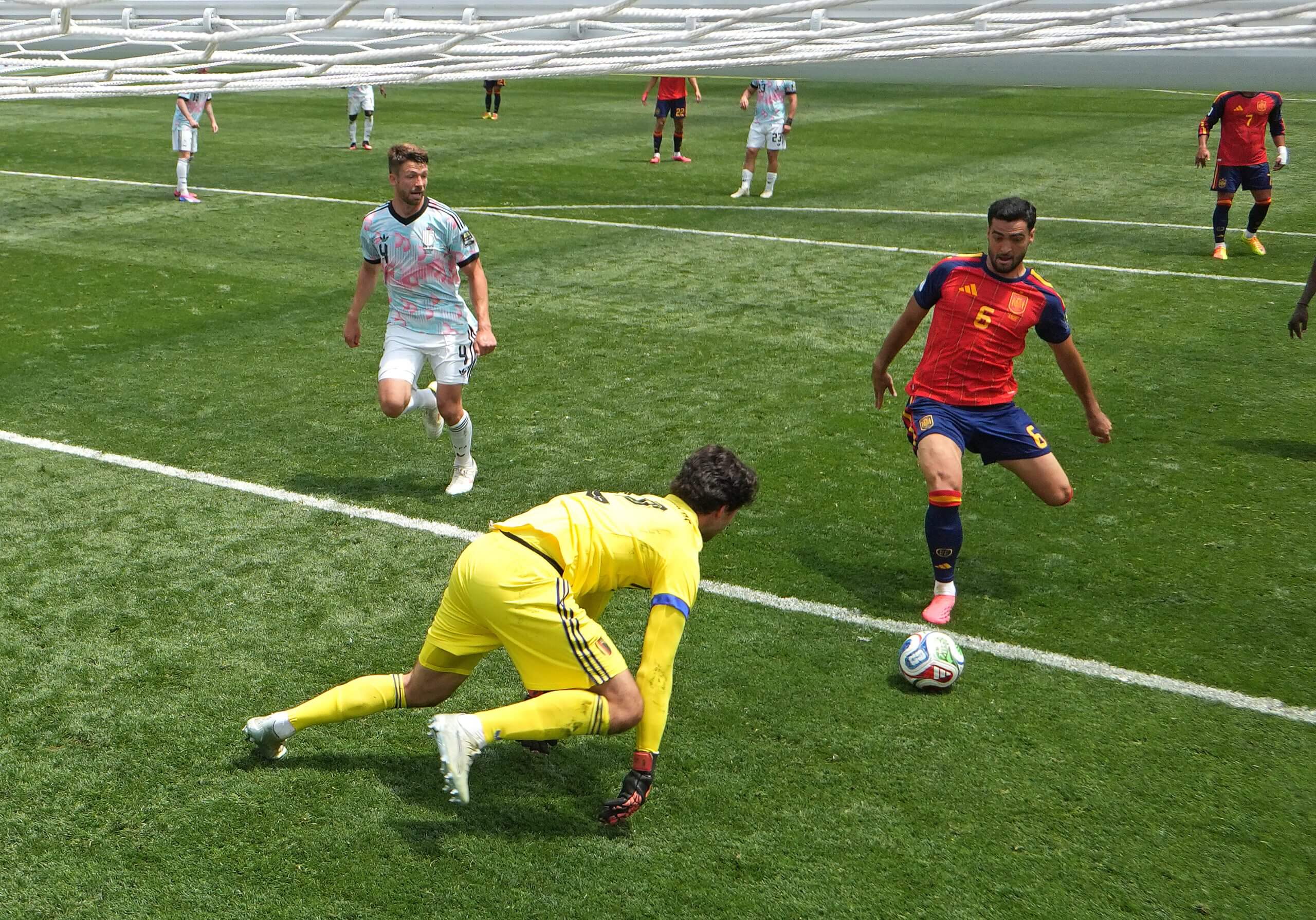 Spain's Mikel Merino prepares to poke the ball home for Spain's late winner against Belgium