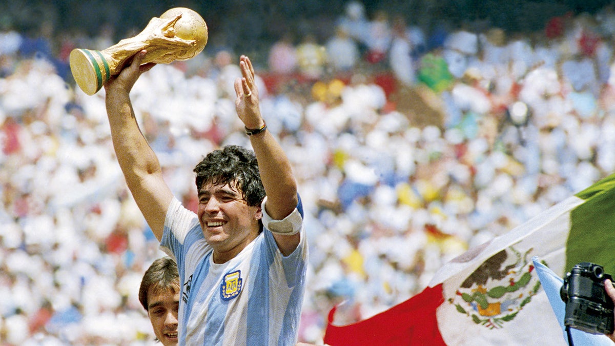 Diego Maradona of Argentina holds the World Cup trophy