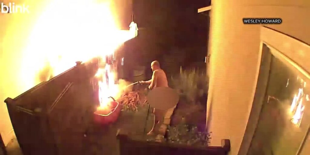 Naked man fights fire outside his home using garden hose Naked man fights fire outside his home using garden hose
