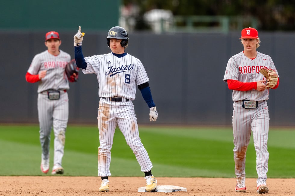 Georgia Tech outfielder Drew Burress (8) signals to the dugout after hitting a double during...