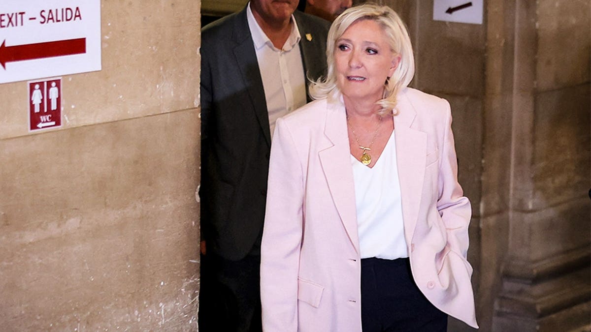 National Rally parliamentary group president Marine Le Pen arrives to attend the verdict in the appeal trial of RN former or actual members on charges of embezzlement of European public funds in a case of alleged European Parliament fake jobs at Paris Court of Appeal on July 7, 2026.
