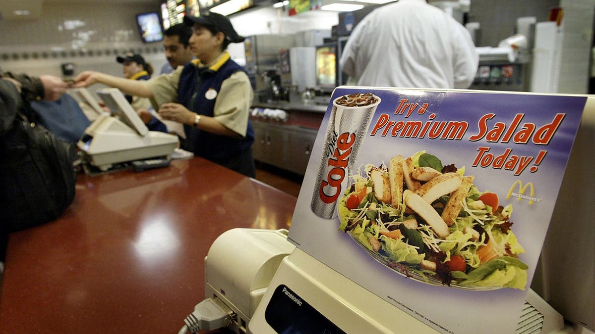 A sign advertising a McDonald's Premium salad.