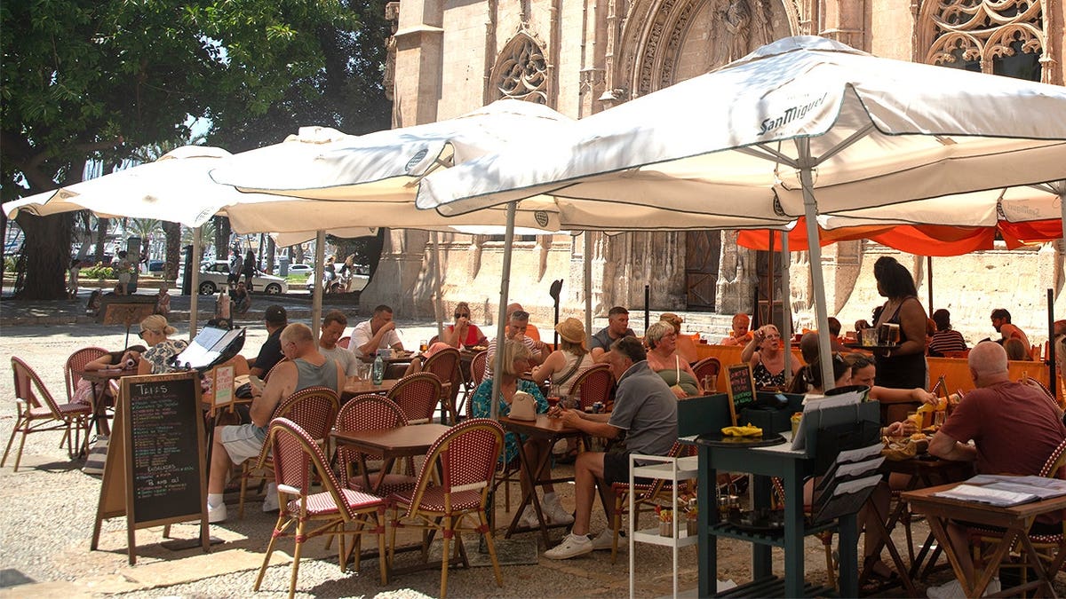 People sitting at cafe table in Mallorca