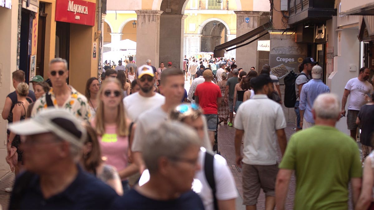 Crowds in Mallorca walking in summer 2025