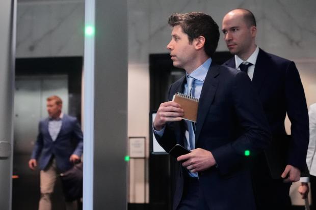 Sam Altman and OpenAI President Greg Brockman arrive at the U.S. District Court in Oakland.