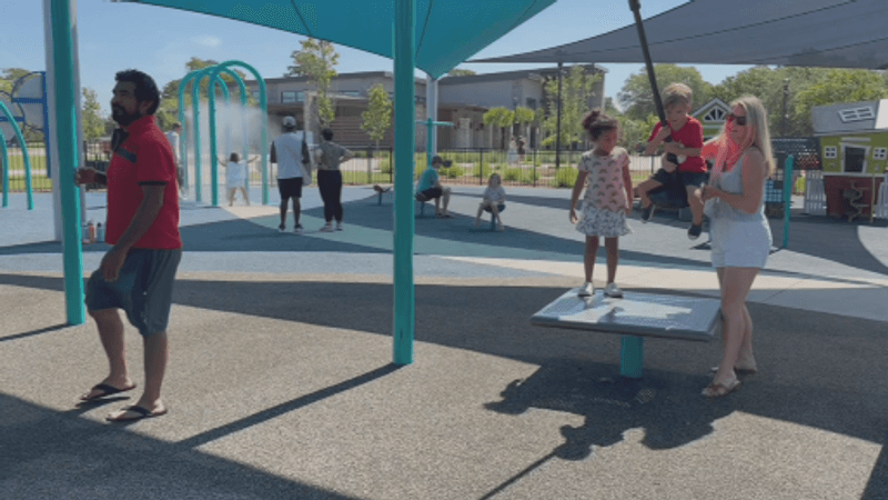 Daniel and his mom at the playground (WCIV)