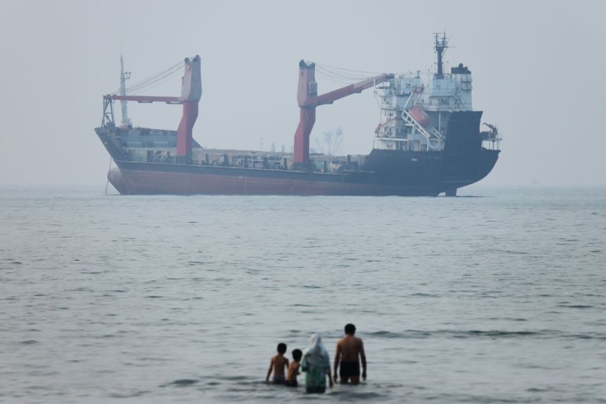 A cargo ship appears anchored in the Strait of Hormuz off Bandar Abbas, Iran, on June 30, 2026.