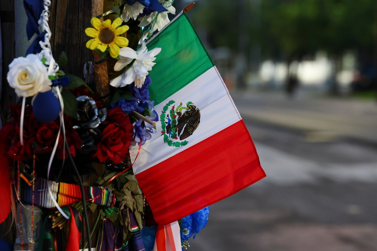 The flag of Mexico is seen at a memorial site where Mexican immigrant Lorenzo Salgado Araujo was fatally shot by an Immigration and Customs Enforcement officer.