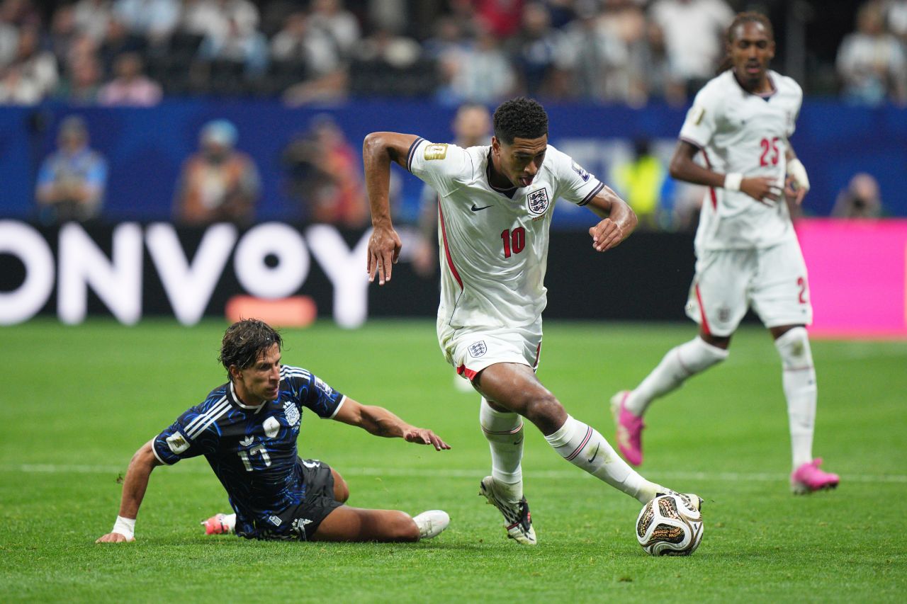 England's Jude Bellingham dribbles away from Argentina's Giuliano Simeone.