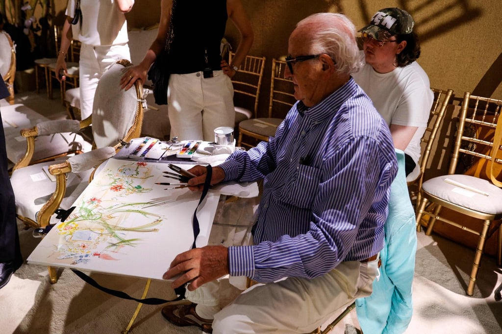 A watercolour artist on the set of the Chanel show. Photo: AFP