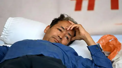 Getty Images Activist Sonam Wangchuk continues his indefinite hunger strike for the sixteenth consecutive day in solidarity with the protest by Cockroach Janta Party demanding the immediate resignation of Union Education Minister Dharmendra Pradhan following paper leak irregularities during the national NEET-UG 2026 medical entrance examinations, at Janatar Mantar on July 13, 2026 in New Delhi, India.