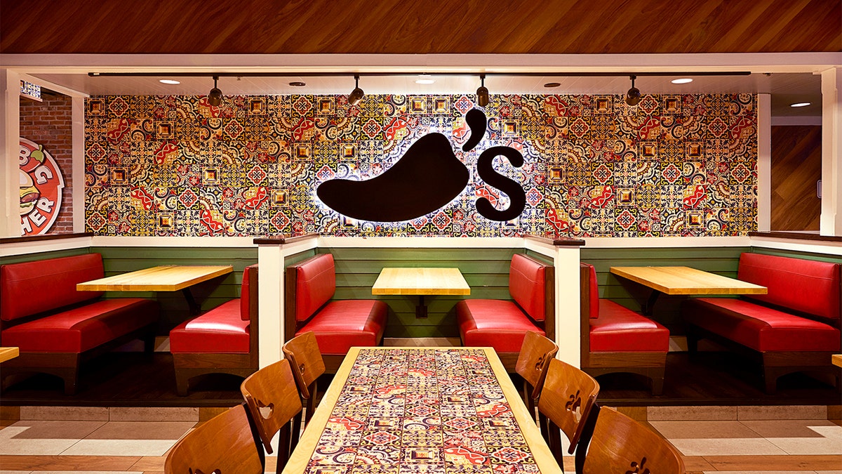 The interior of a redesigned Chili's showing the dining room.