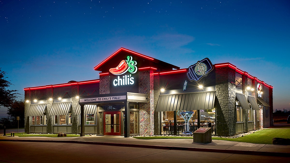 The exterior of a redesigned Chili's at night.