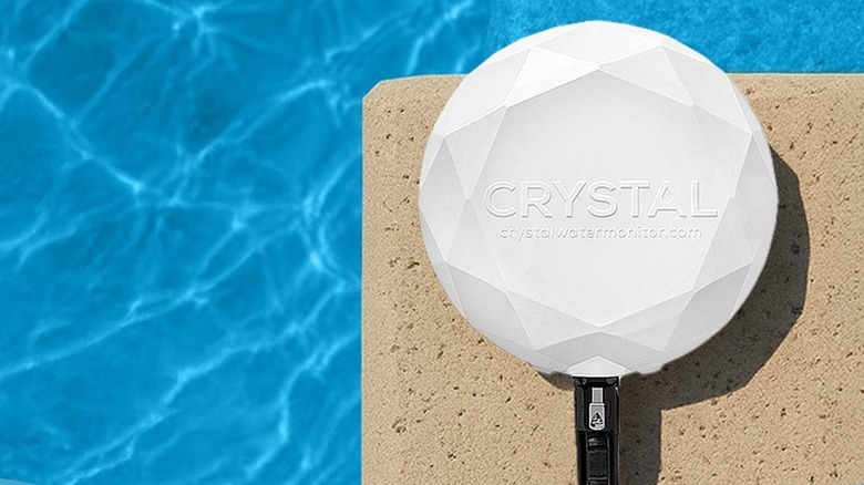 The Crystal smart water monitor installed beside a swimming pool.