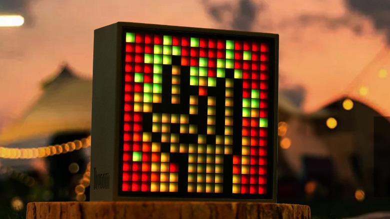 The Divoom TimeBox Evo pixel art Bluetooth speaker with the "rock on" sign on the screen.