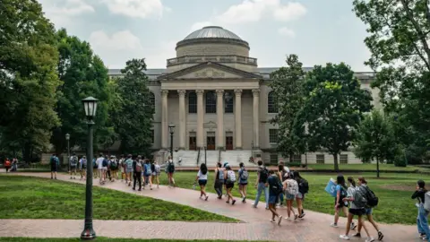 Getty Images People walk on the campus of the University of North Carolina Chapel Hill on June 29, 2023 in Chapel Hill, North Carolina
