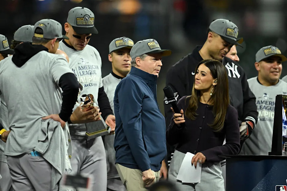 CLEVELAND, OHIO - OCTOBER 19: <a class="link " href="https://sports.yahoo.com/mlb/teams/ny-yankees/" data-i13n="sec:content-canvas;subsec:anchor_text;elm:context_link" data-ylk="slk:New York Yankees;sec:content-canvas;subsec:anchor_text;elm:context_link;itc:0" data-yga="{"yLinkElement":"context_link","yModuleName":"content-canvas","yLinkText":"New York Yankees","ySubModuleName":"anchor_text","yHasCommerce":false}">New York Yankees</a> chairman Hal Steinbrenner is interviewed as he celebrates the team's 5-2 win over the <a class="link " href="https://sports.yahoo.com/mlb/teams/cleveland/" data-i13n="sec:content-canvas;subsec:anchor_text;elm:context_link" data-ylk="slk:Cleveland Guardians;sec:content-canvas;subsec:anchor_text;elm:context_link;itc:0" data-yga="{"yLinkElement":"context_link","yModuleName":"content-canvas","yLinkText":"Cleveland Guardians","ySubModuleName":"anchor_text","yHasCommerce":false}">Cleveland Guardians</a> in ten innings in Game Five of the American League Championship Series at Progressive Field on October 19, 2024 in Cleveland, Ohio. (Photo by Nick Cammett/Diamond Images via Getty Images) | Diamond Images/Getty Images