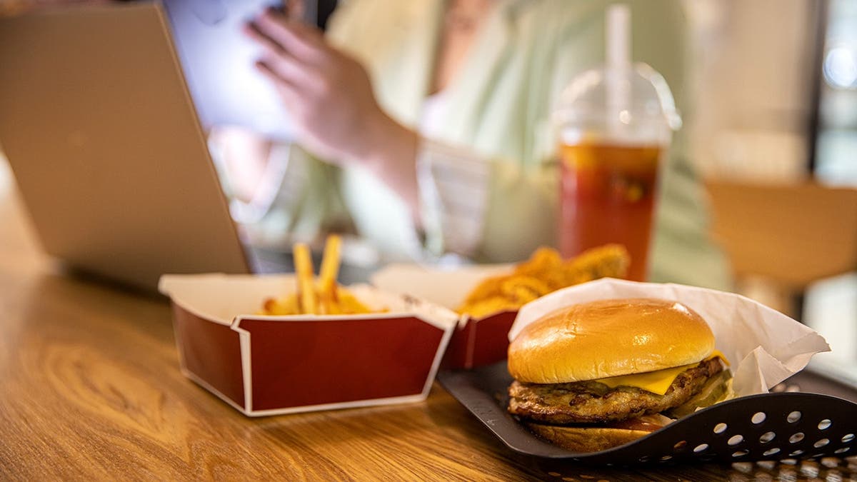 Fast food sits on a table.
