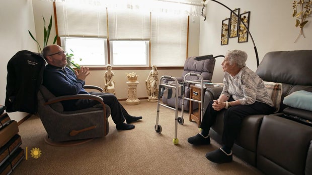 father-gary-benz-visits-viola-weinhart.jpg