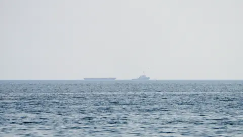 Reuters Vessels float in the Strait of Hormuz.