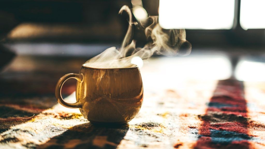 cozy close-up shot of a steamy cup