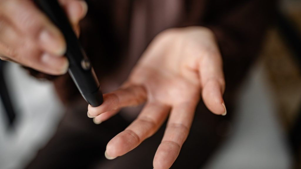 A person checking their blood sugar levels.