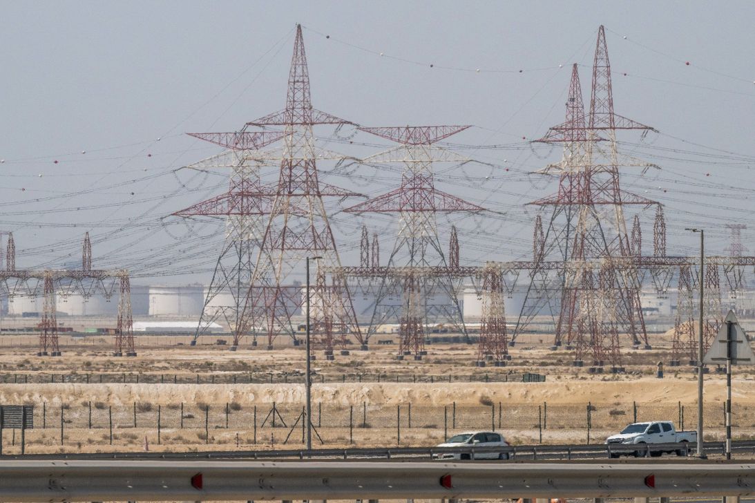 Motorists drive past an ADNOC Gas a subsidiary of the Abu Dhabi National Oil Company facility in Abu Dhabi on March 3, 2026.
