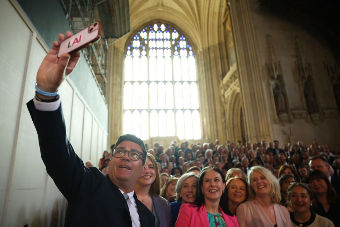 Andy Burnham takes a "selfie" with the Parliamentary Labour Party after his swearing-in at the Houses of Parliament in London, England on June 22.