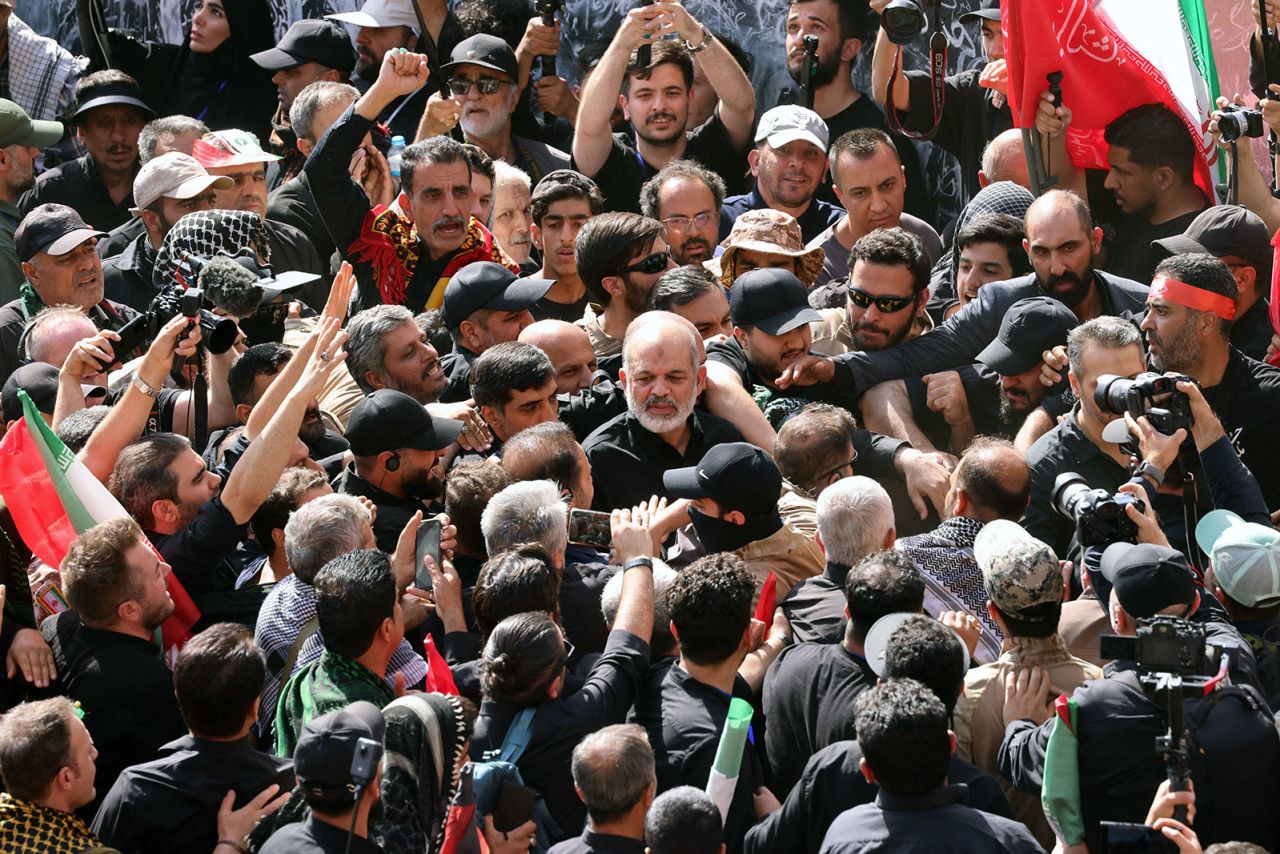 Chief of Iran's Revolutionary Guards, Ahmad Vahidi arrives to pray for Iran's slain supreme leader Ayatollah Ali Khamenei with mourners during the second day of funeral ceremonies at the Grand Mosalla in Tehran on Sunday.