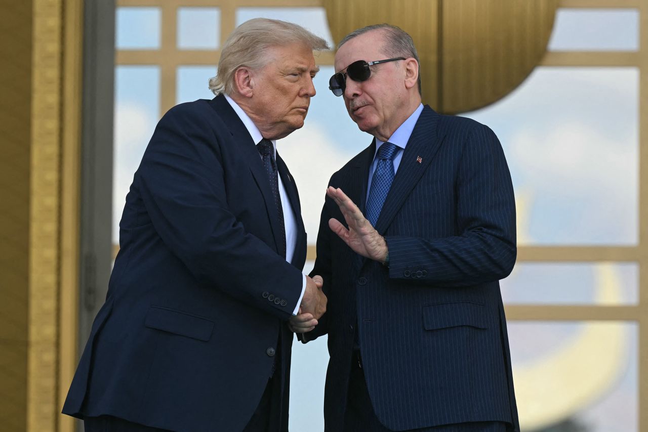 Turkish President Recep Tayyip Erdogan shakes hands with President Donald Trump during a state arrival ceremony at Bestepe Presidential Compound in Ankara, Turkey, on Tuesday.