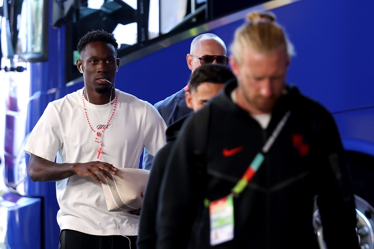 US striker Folarin Balogun, left, arrives for the match against Belgium.