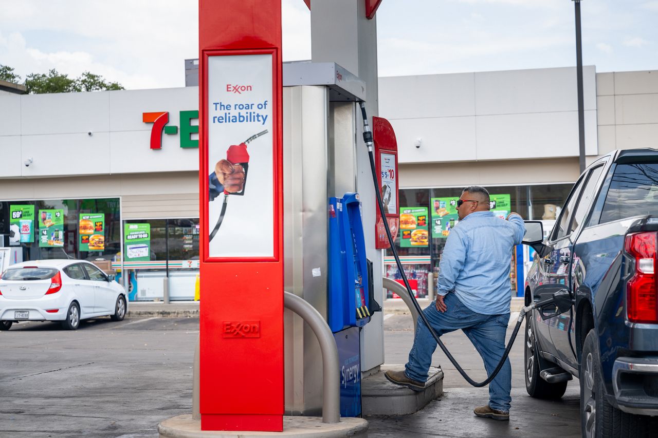 A person pumps gas at a gas station in Austin, Texas, on July 10.