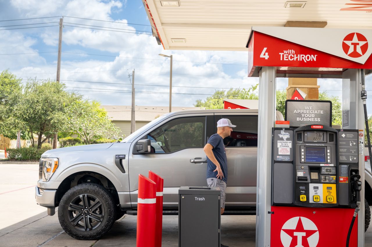 A person pumps gas at a Texaco gas station in Austin, Texas on July 10.