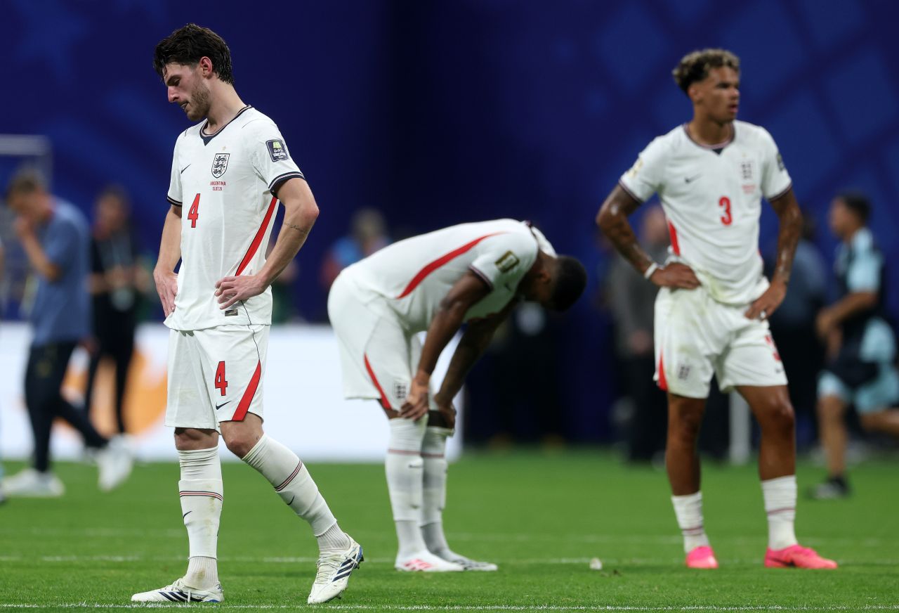 England players react after the loss.