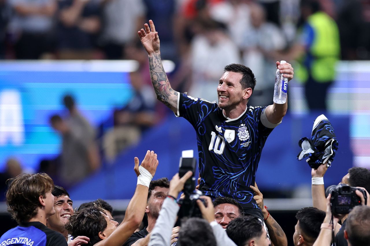 Lionel Messi celebrates with teammates after the win.