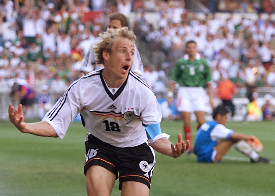 German Jurgen Klinsmann jubilates after scoring the first goal 29 June at the Stade de la Mosson in Montpellier, south of France, during the 16th Soccer World Cup second round match between Germany and Mexico. Germany won 2-1.(ELECTRONIC IMAGE) AFP PHOTO BORIS HORVAT (Photo by BORIS HORVAT / AFP via Getty Images)
