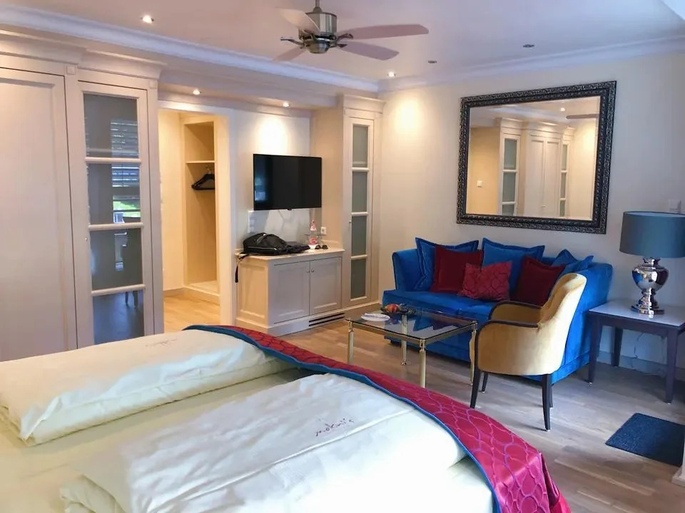 Modern guest room at Mokni's Palais Hotel & Spa in Bad Wildbad, Germany, steps from Palais Thermal.