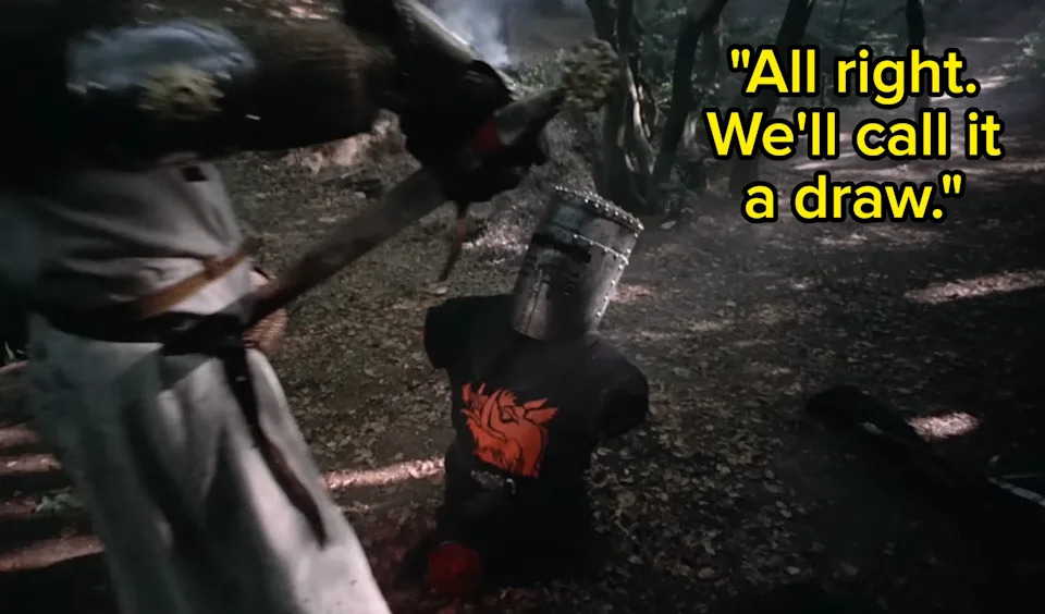 A knight in medieval armor stands over another in a forest. The seated knight appears to have lost an arm, referencing a comedic medieval scene