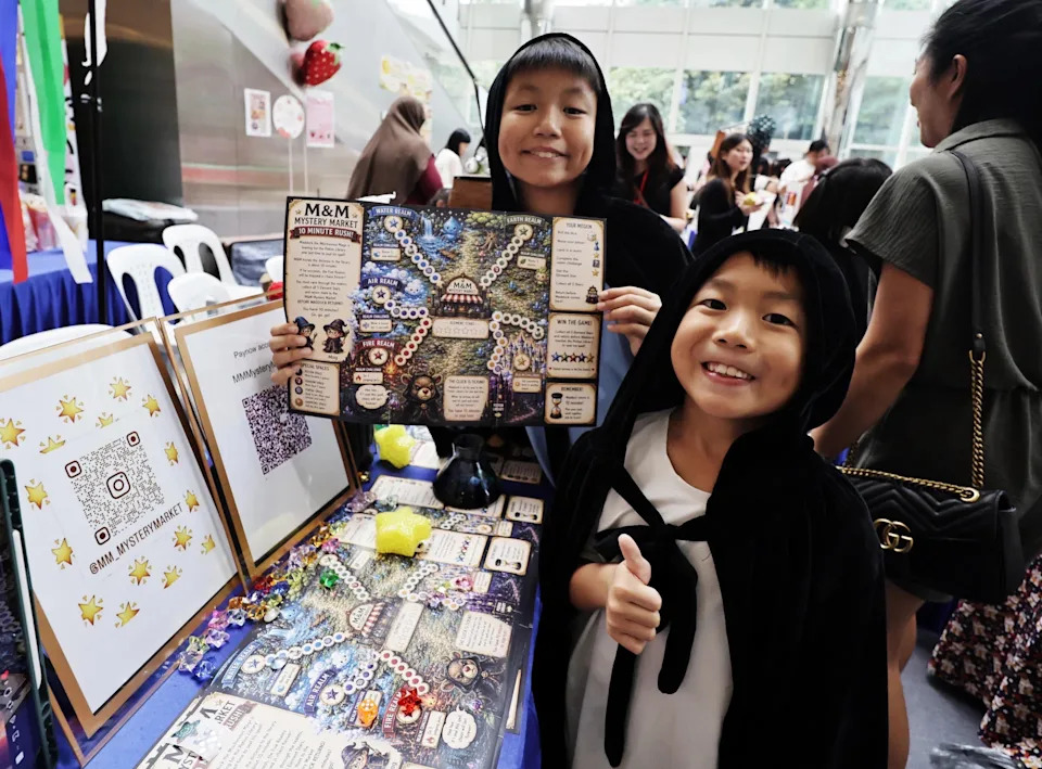 Brothers Malcolm Ng (left), 11, and Magnus Ng, seven, created a board game called Element Rush.