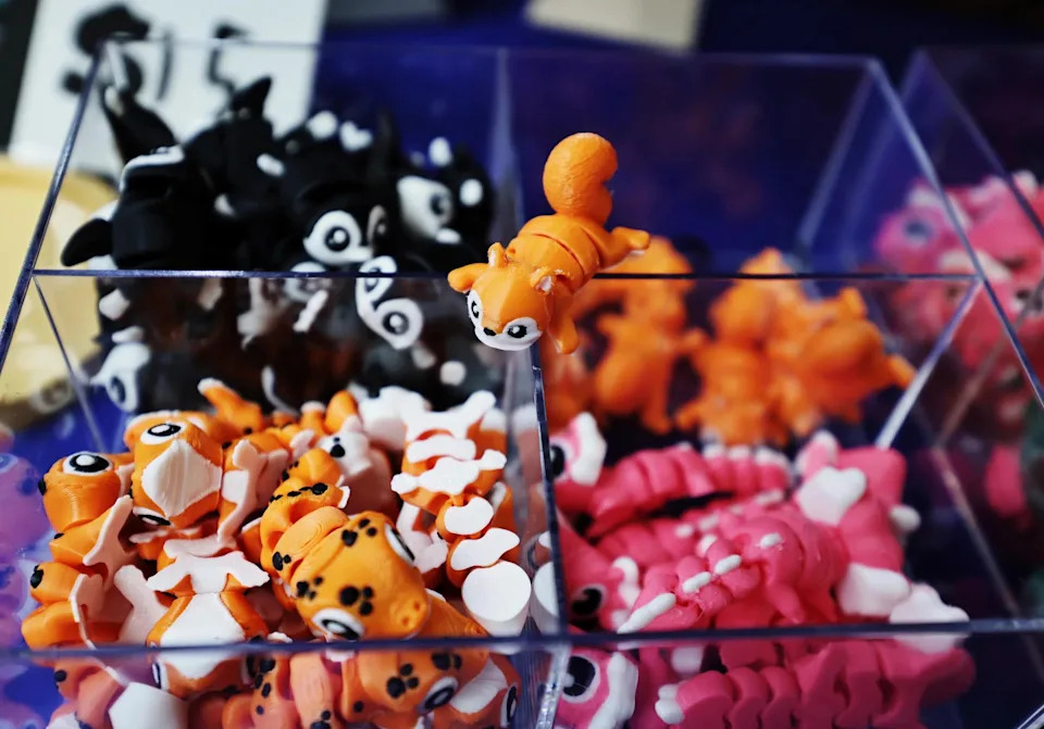 A selection of Rui Qi's 3D-printed figurines at his booth.