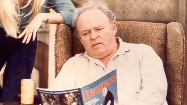 Carol O'Connor reading a magazine as Archie Bunker