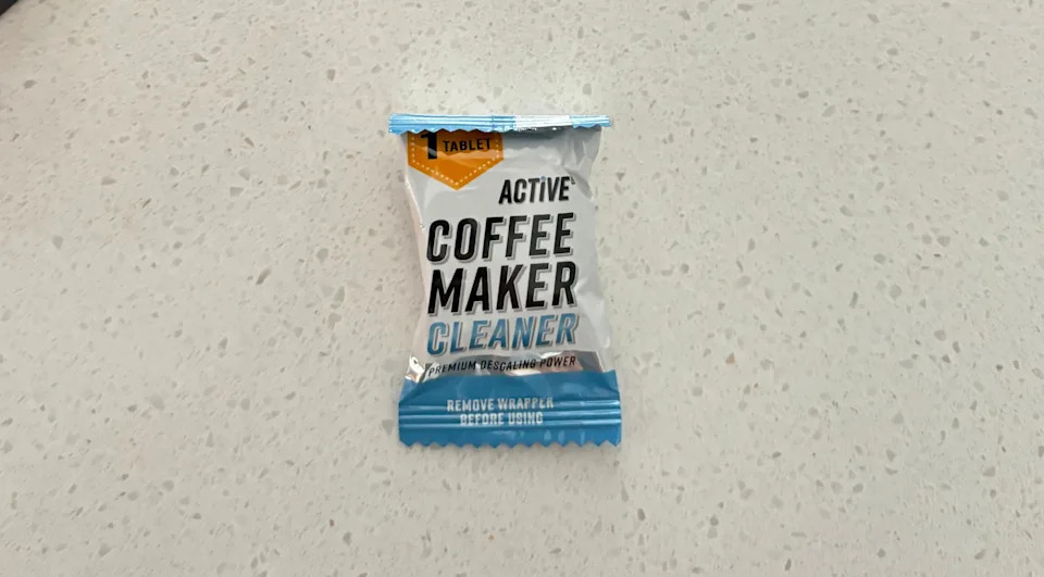 an amazon coffee maker descaling tablet on a counter top