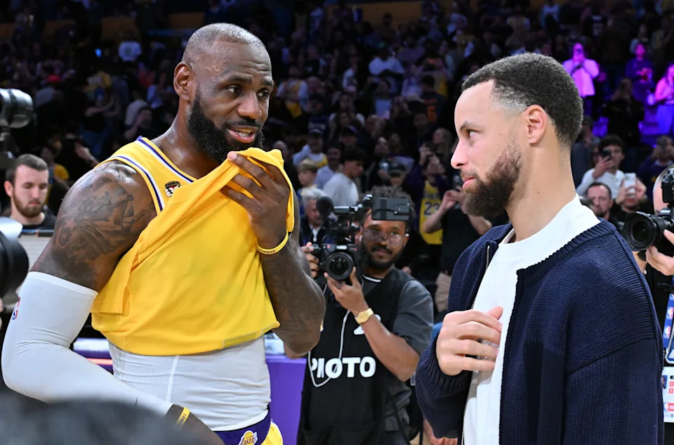 LOS ANGELES, CALIFORNIA - FEBRUARY 07: LeBron James speaks with Stephen Curry following a basketball game between the Los Angeles Lakers and the Golden State Warriors at Crypto.com Arena on February 07, 2026 in Los Angeles, California. NOTE TO USER: User expressly acknowledges and agrees that, by downloading and or using this photograph, User is consenting to the terms and conditions of the Getty Images License Agreement. (Photo by Allen Berezovsky/Getty Images)