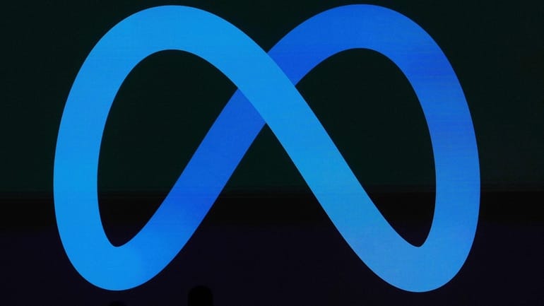 A Meta logo is shown on a video screen at...