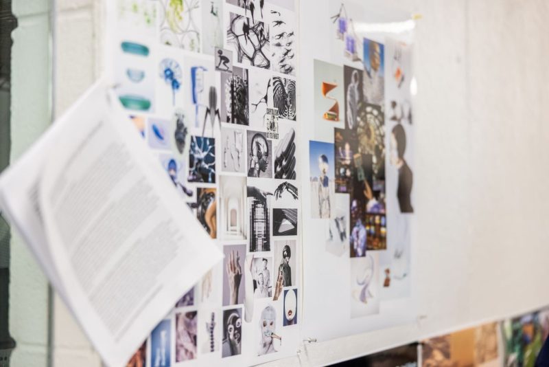 A mood board featuring images, sketches, and visual references used by students to explore and communicate concepts for imagined future worlds.