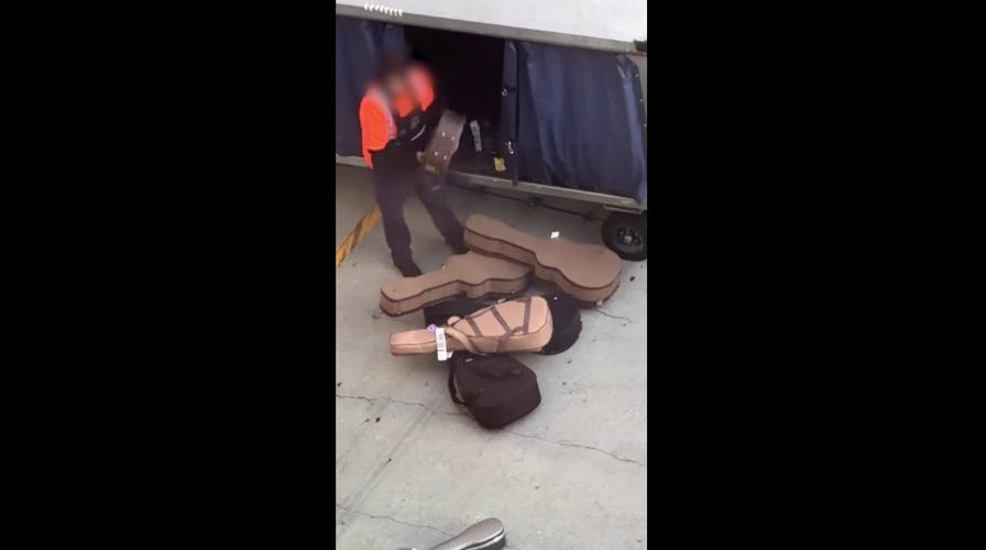 Caught on camera: Airport crew member repeatedly throws guitar cases onto tarmac