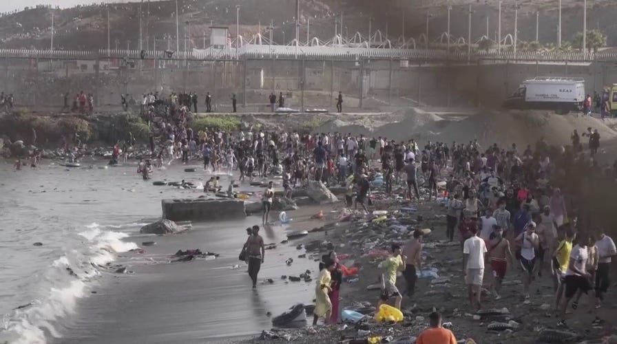 ‘We don’t have a good life’: Thousands of migrants pour into Spain