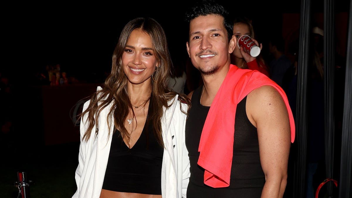 Jessica Alba and Danny Ramirez at a Raising Cane's party at Snoop Dogg's compound in June 2026.